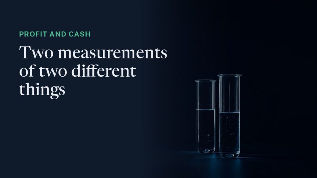 Cover: two glass cylinders of different heights side by side in low light, both part-filled and lit blue. Overlaid: "Profit and cash - two measurements of two different things."