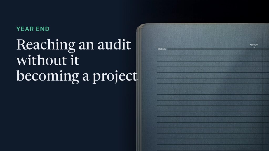 Cover: an overhead view of a dark ruled ledger in raking light, one column catching green. Overlaid: "Year end - reaching an audit without it becoming a project."